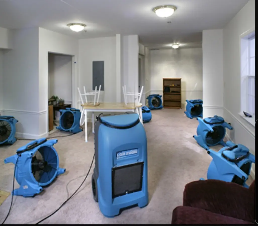 Air movers and dehumidifier setup for Water Damage Restoration in Troy